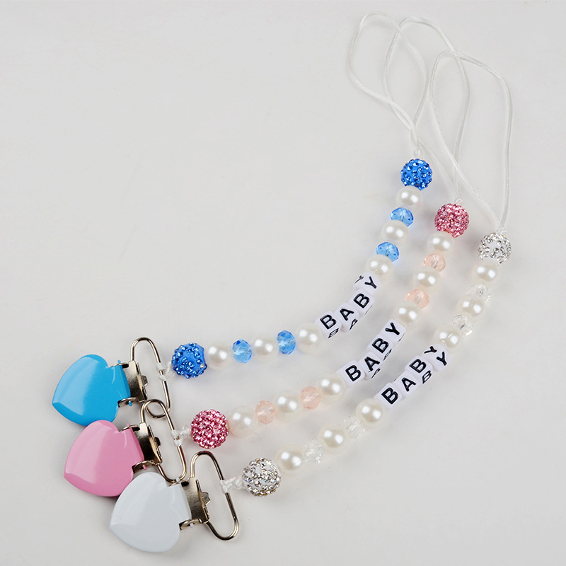 Attache-tétine perle anti-chut - String Tension Clip avis et prix